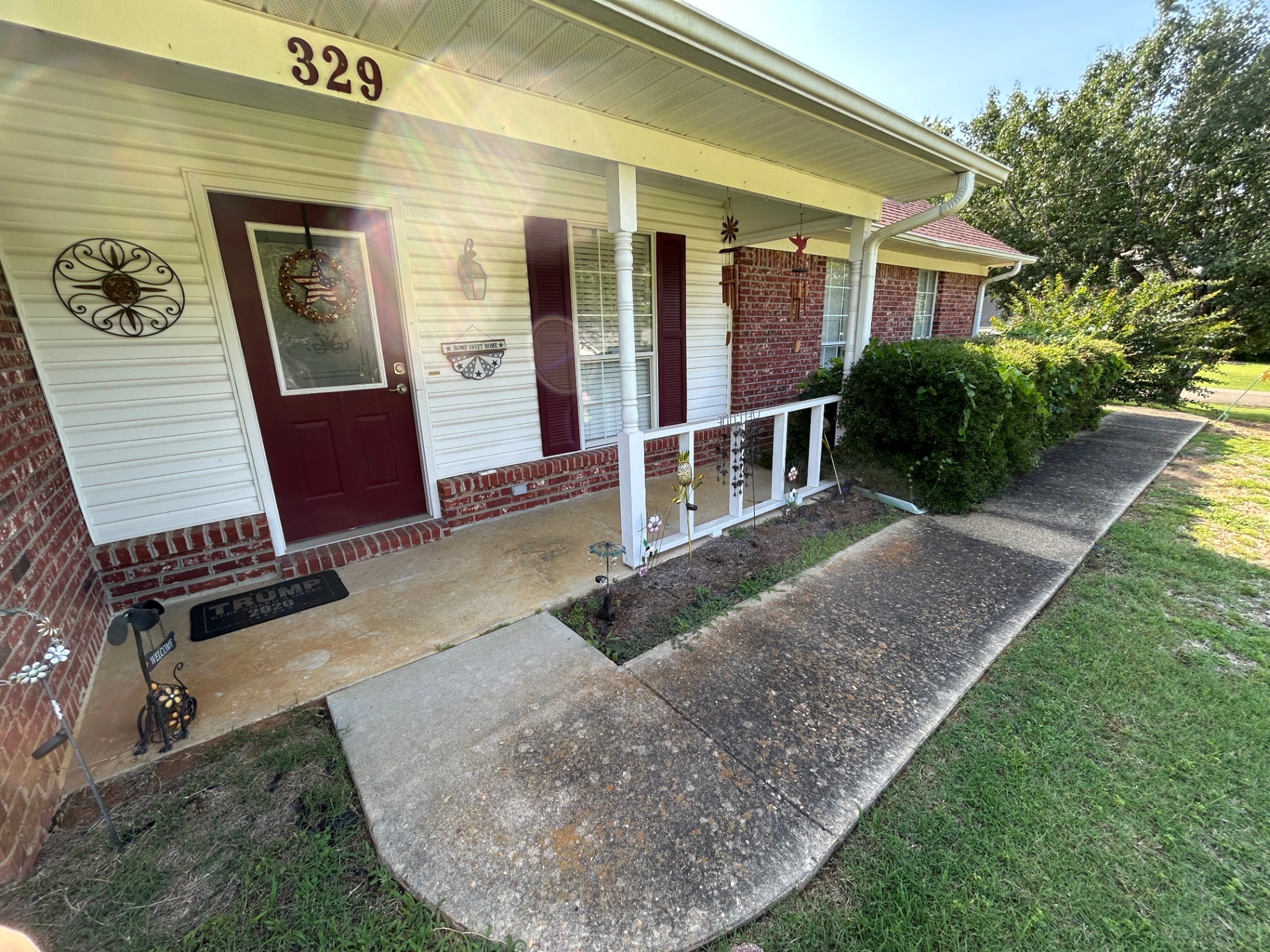 Walkway & porch concrete — before cleaning in Pontotoc, MS