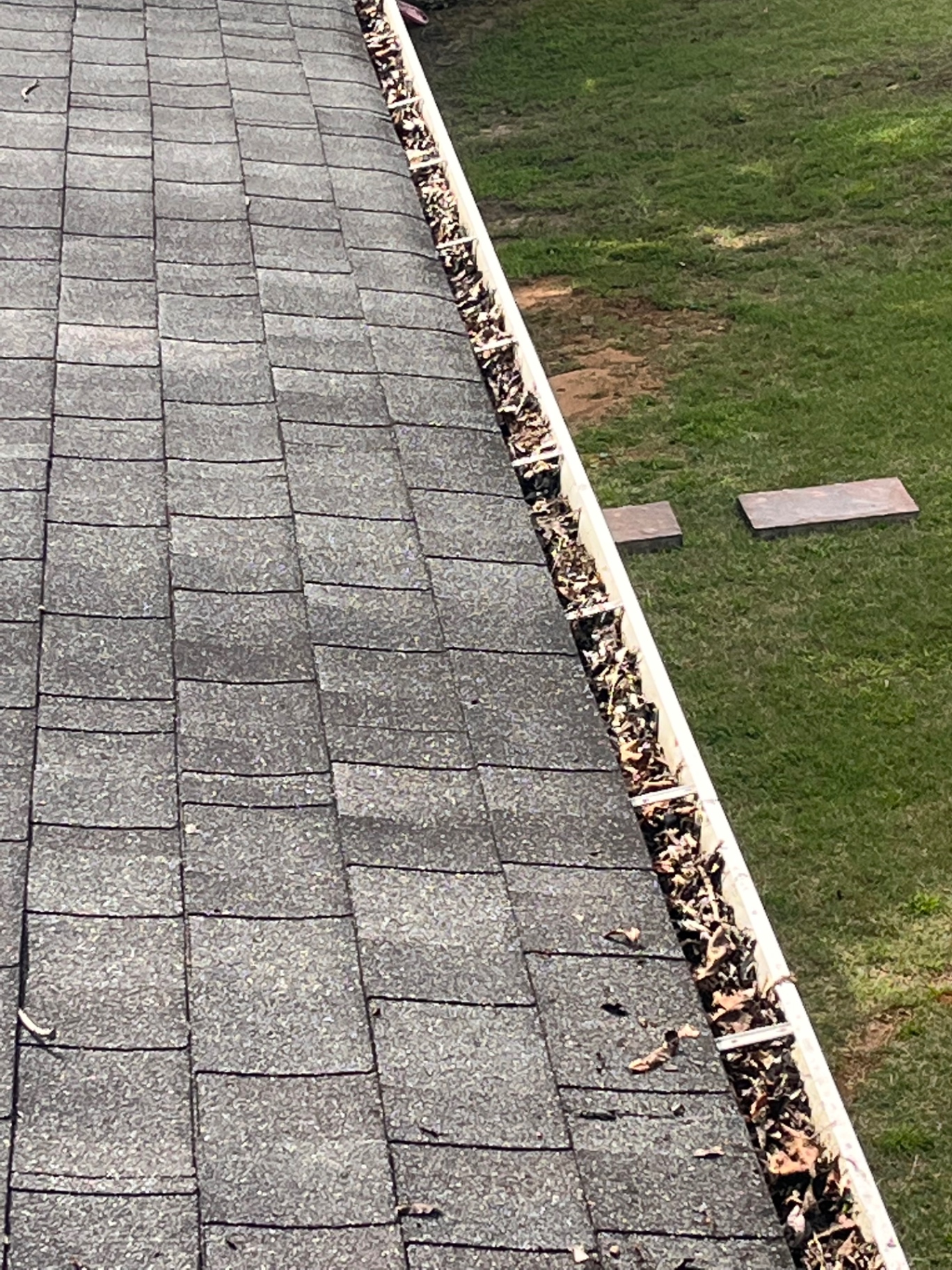 Gutter cleaning — before cleaning in Pontotoc, MS